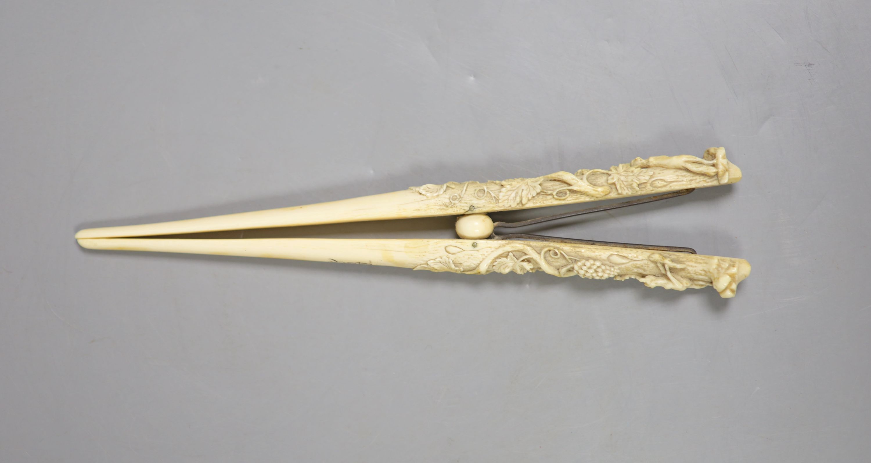 A pair of late 19th century carved ivory glove stretchers